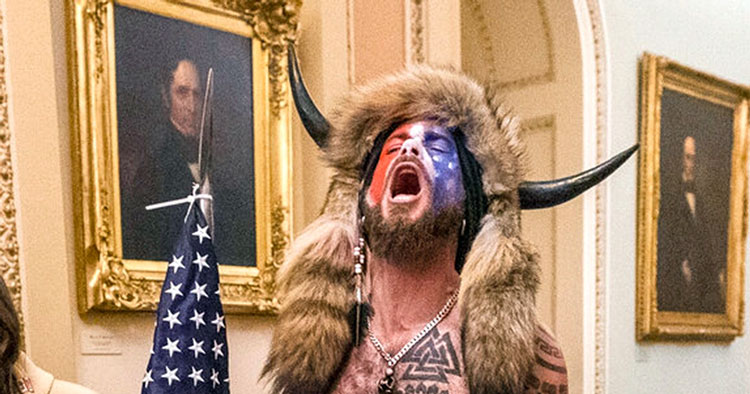‘QAnon Shaman’ and other Jan. 6 rioters from Arizona celebrate Trump pardons that many denounce as a slap to democracy and police